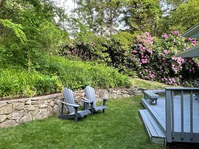 Private backyard with Adirondack chairs